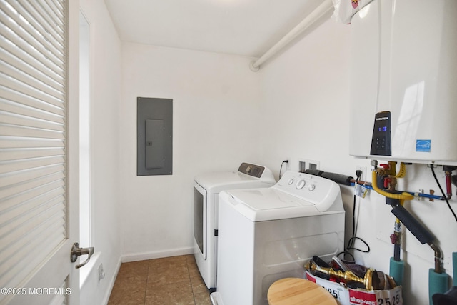 washroom with tile patterned flooring, washing machine and dryer, electric panel, and water heater