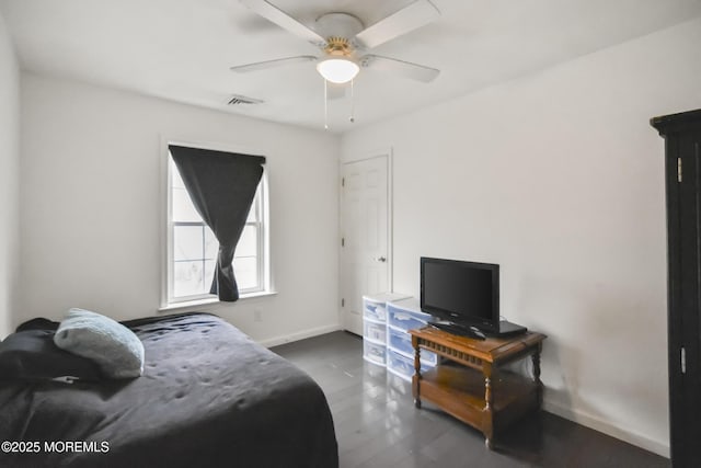 bedroom featuring dark hardwood / wood-style floors and ceiling fan