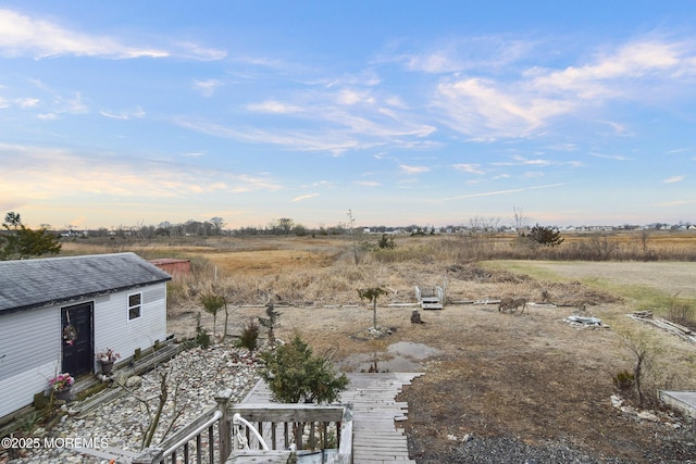 view of yard with a rural view