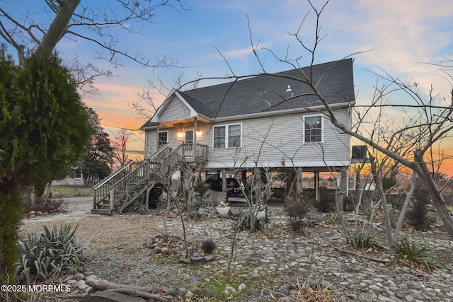 view of back house at dusk