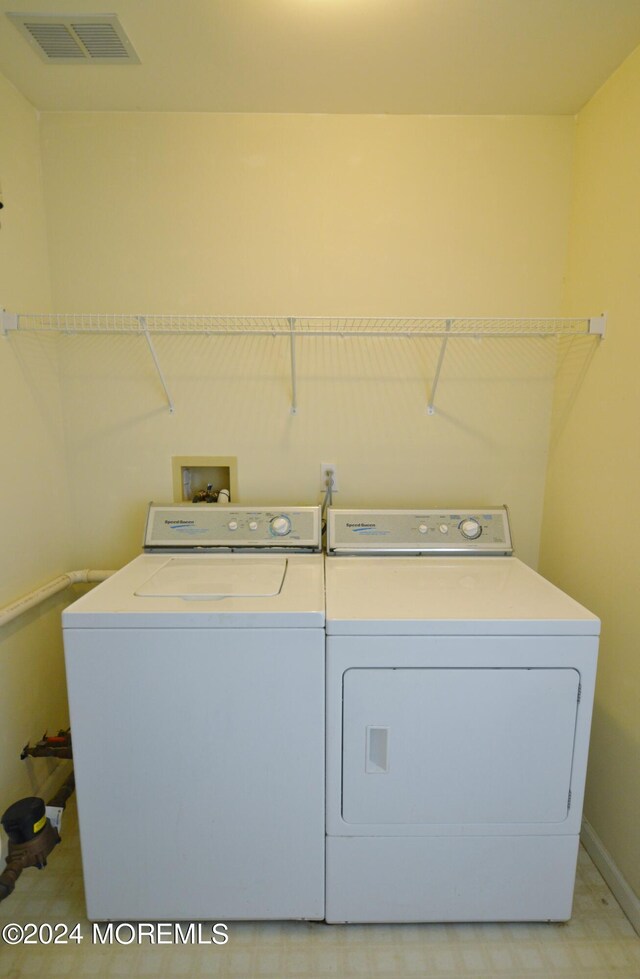 laundry area with washer and dryer