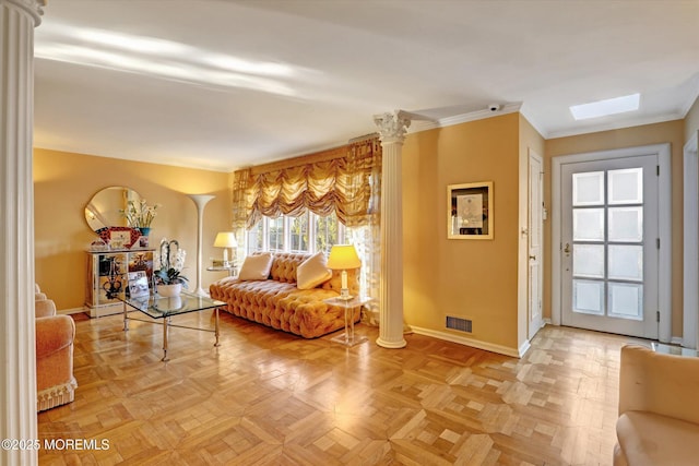 living room featuring ornate columns, ornamental molding, and parquet flooring