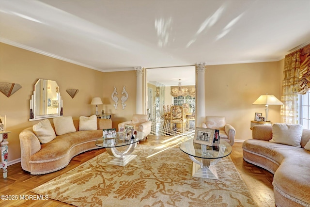 living room featuring an inviting chandelier, parquet floors, ornamental molding, and ornate columns