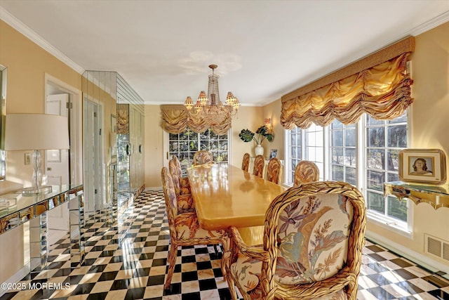 dining room with ornamental molding and a chandelier