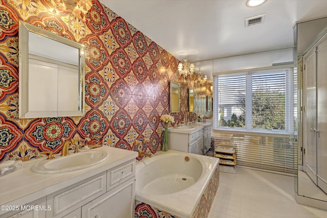 bathroom with vanity, tiled bath, and tile walls