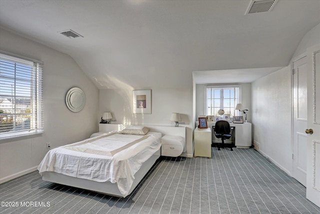 carpeted bedroom featuring lofted ceiling