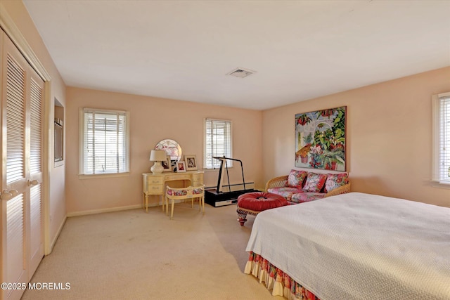 bedroom with light colored carpet