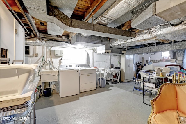 basement featuring sink and washer and clothes dryer