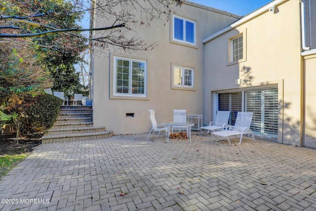 rear view of property featuring a patio area