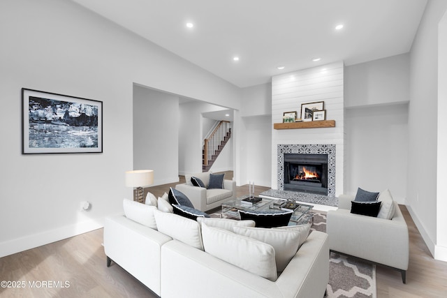 23A Stoney Hill Rd, Cream Ridge, NJ 08514 - living room featuring a fireplace, light wood-type flooring, stairway, baseboards, and recessed lighting