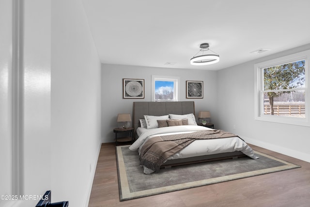 23A Stoney Hill Rd, Cream Ridge, NJ 08514 - bedroom featuring baseboards, multiple windows, and wood finished floors