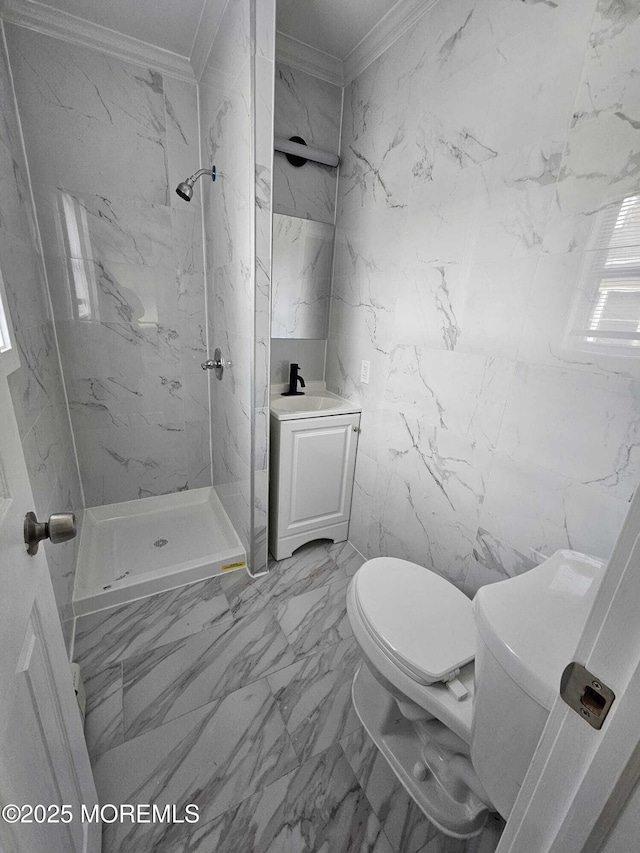 bathroom with toilet, ornamental molding, tiled shower, and vanity