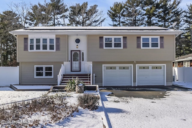 split foyer home featuring a garage