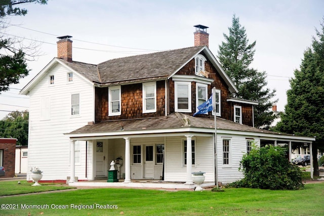 583 Cedar Ave, West Long Branch, NJ 07764 - rear view of property featuring a chimney, roof with shingles, and a lawn