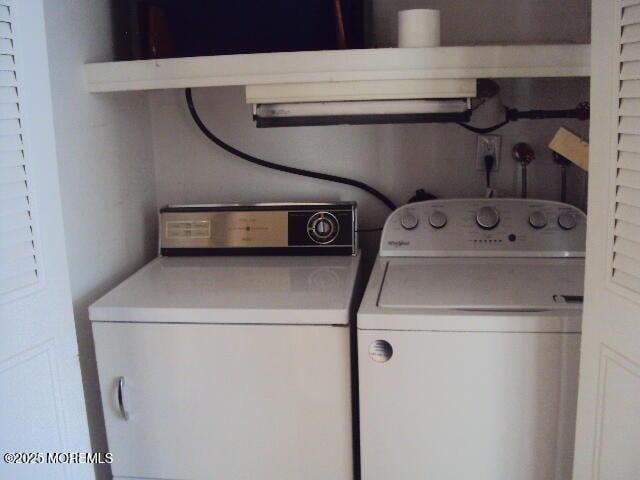 laundry room with independent washer and dryer