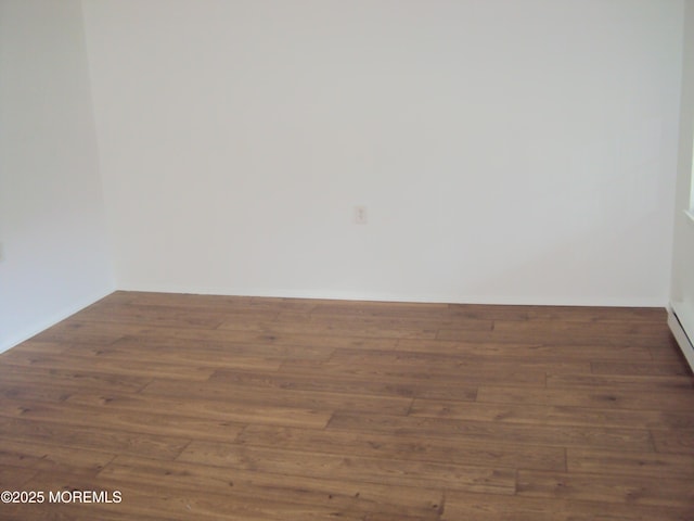 unfurnished room featuring dark hardwood / wood-style floors