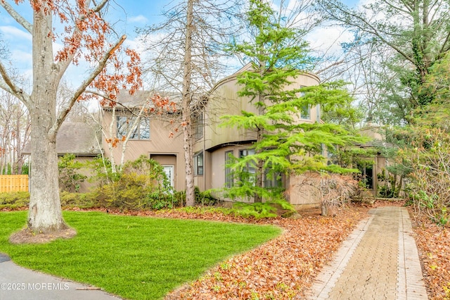 view of property exterior with a lawn