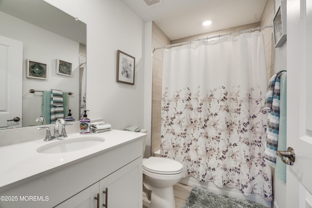 full bathroom with vanity, toilet, shower / bathtub combination with curtain, and wood-type flooring