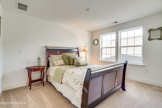 bedroom featuring light colored carpet