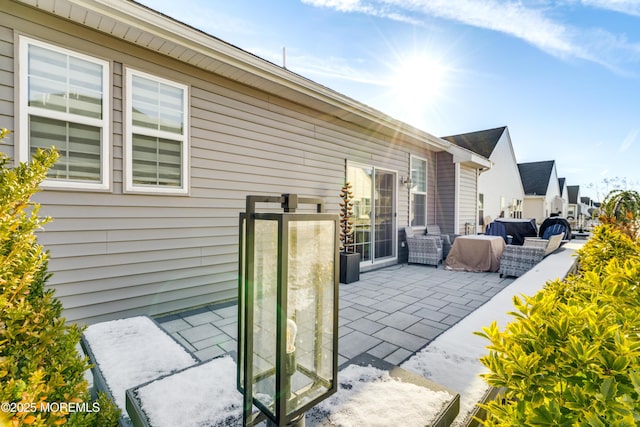 view of side of property with a patio area