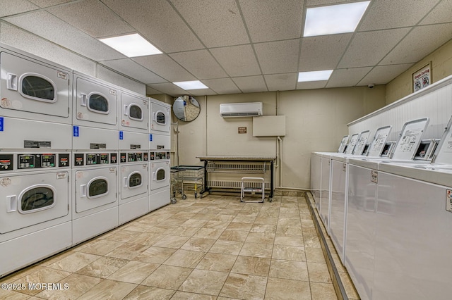 clothes washing area with stacked washer / drying machine, a wall mounted air conditioner, and independent washer and dryer