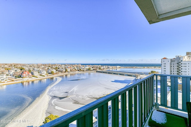 balcony featuring a water view