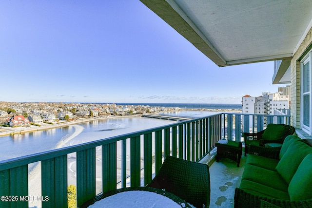 balcony featuring a water view