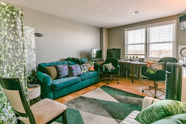 living room with parquet flooring