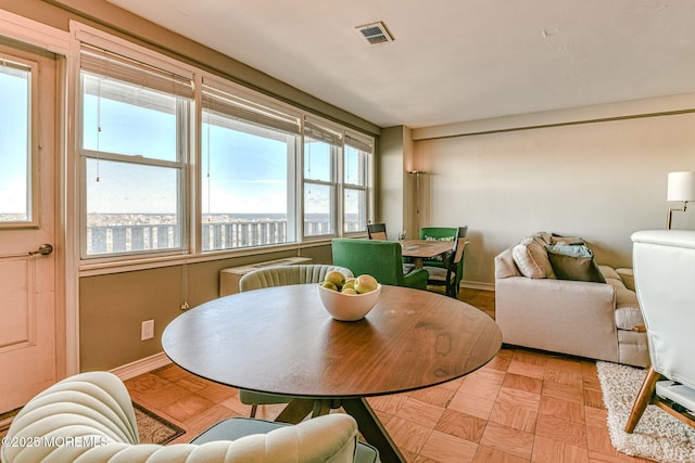 dining area featuring light parquet flooring