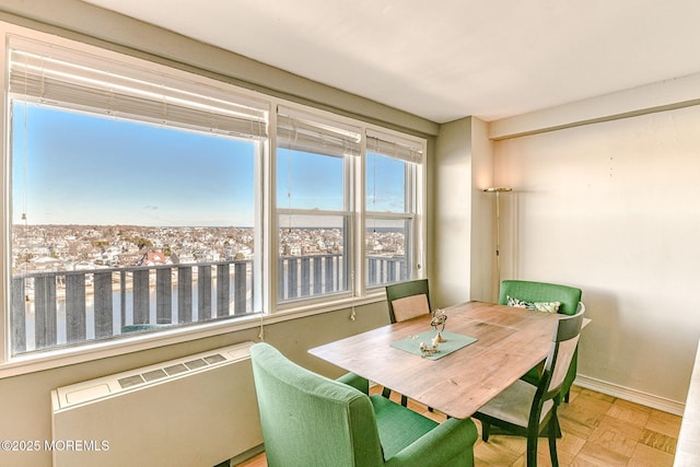 dining space featuring light parquet flooring