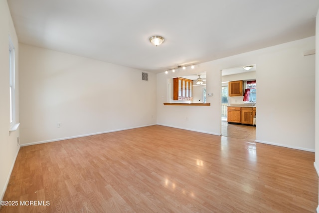 unfurnished room with light hardwood / wood-style floors