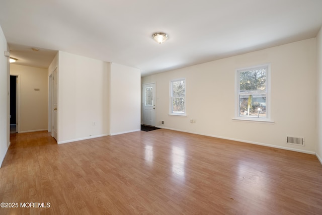 unfurnished room with light hardwood / wood-style flooring