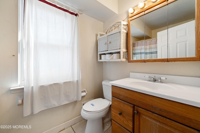 bathroom with a shower with shower curtain, tile patterned flooring, vanity, and toilet