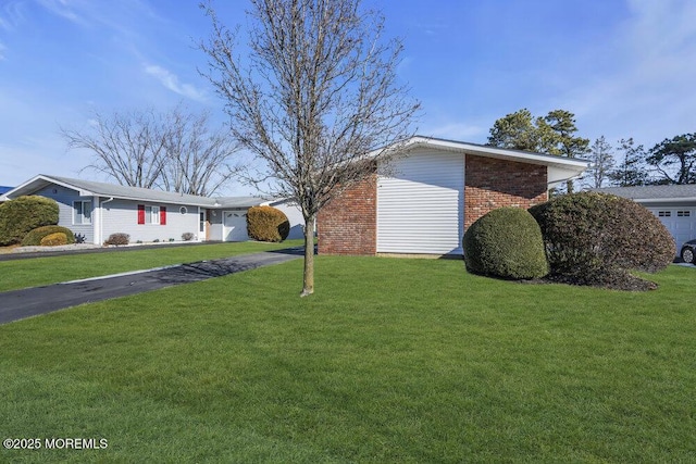 view of property exterior with a lawn