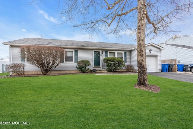 single story home with a front yard and a garage