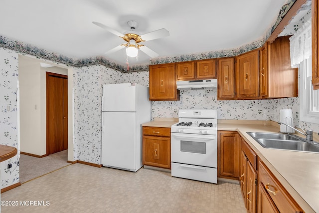 kitchen with ceiling fan, sink, and white appliances