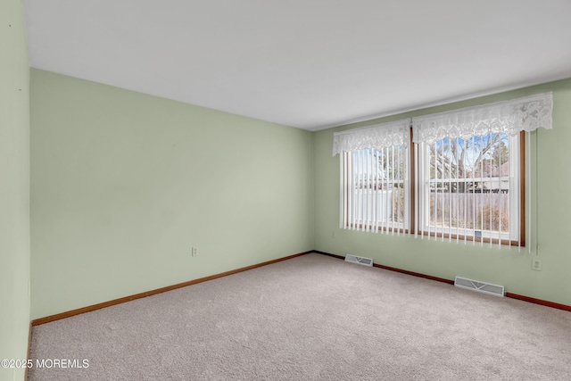 unfurnished room with carpet flooring