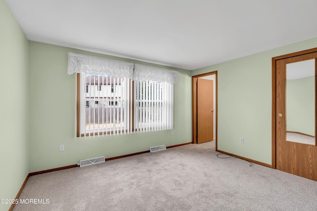 unfurnished room featuring carpet floors