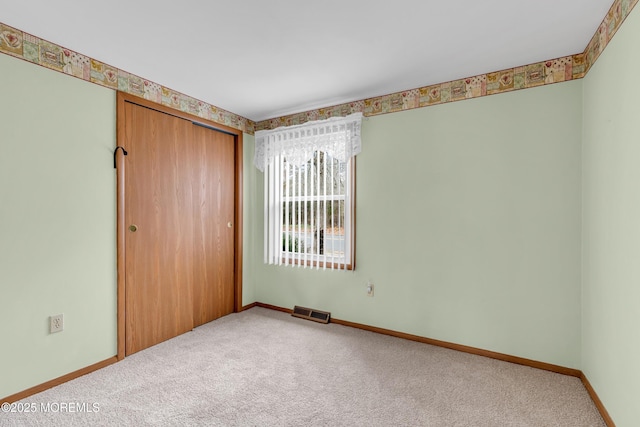 unfurnished room with carpet