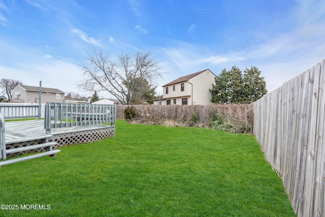 view of yard with a wooden deck