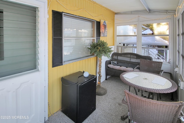 sunroom with beam ceiling