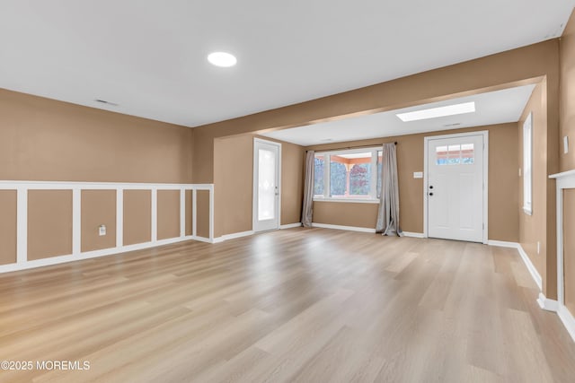 entrance foyer with light hardwood / wood-style flooring