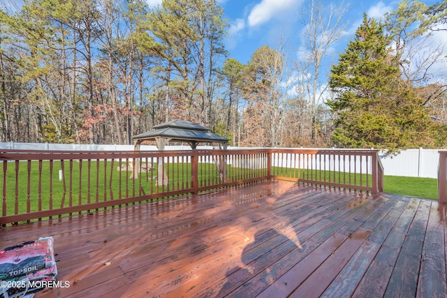 deck with a gazebo and a lawn