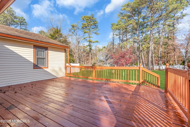 deck featuring a lawn