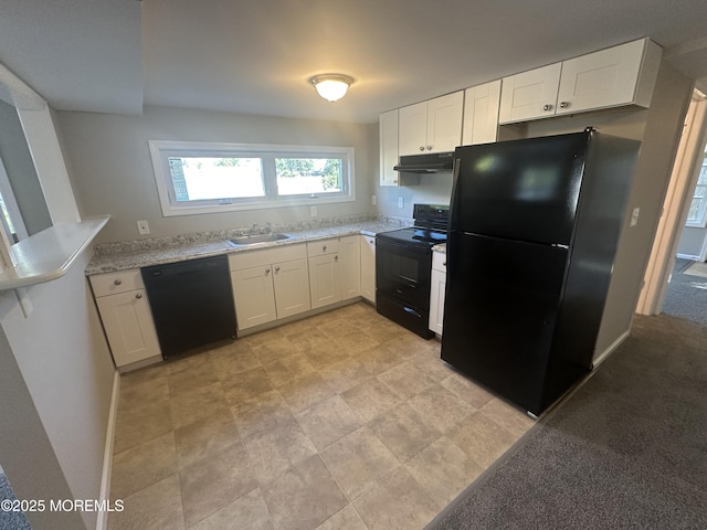 kitchen with white cabinets, sink, light stone countertops, and black appliances