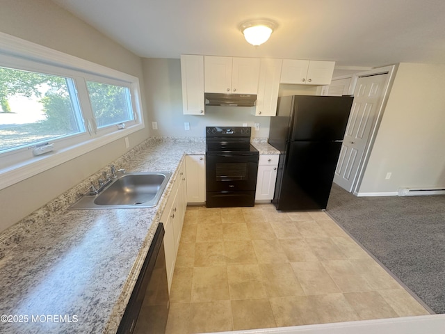 kitchen with refrigerator, black electric range oven, stainless steel dishwasher, sink, and white cabinetry