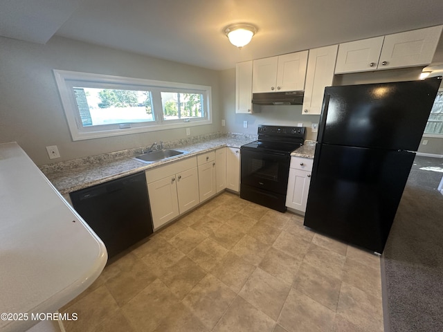 kitchen with black appliances, white cabinetry, and sink