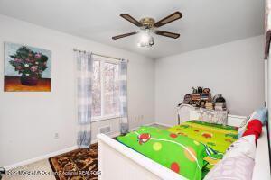 game room with ceiling fan and carpet floors