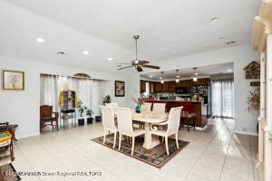 dining area featuring tile patterned flooring and ceiling fan