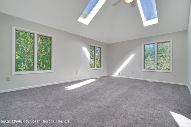 unfurnished room with ceiling fan, carpet floors, and vaulted ceiling